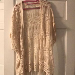 Knit Cardigan with fringe on bottom.